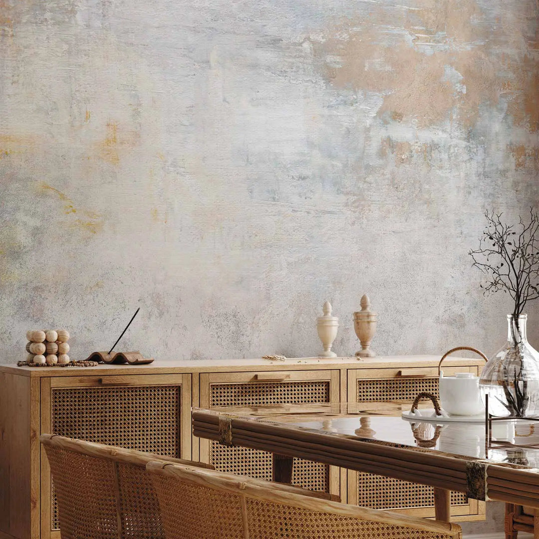 Abstract wall mural with a weathered plaster effect in light gray and warm brown tones - interior with wooden furniture