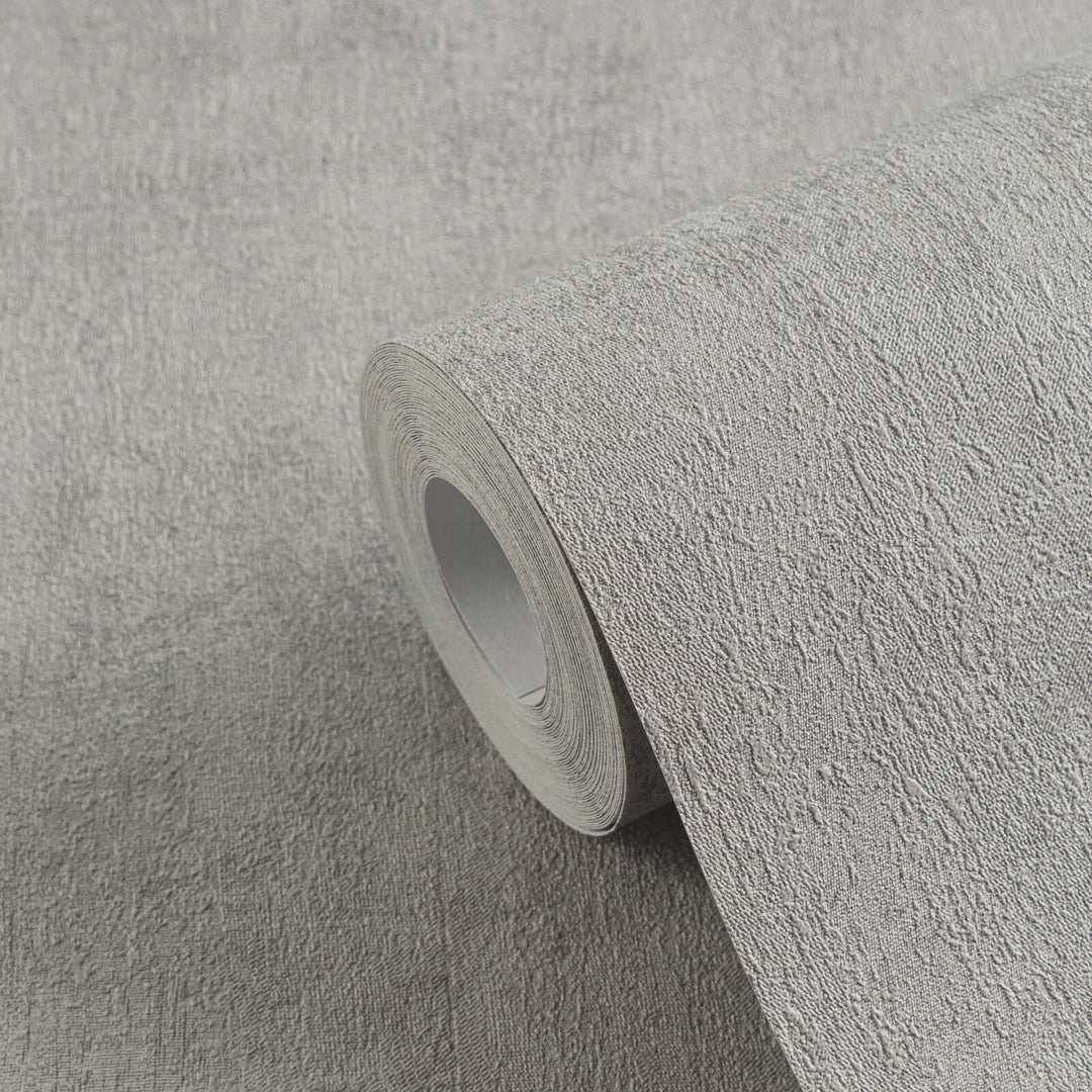 Roll of gray textured wallpaper in close-up