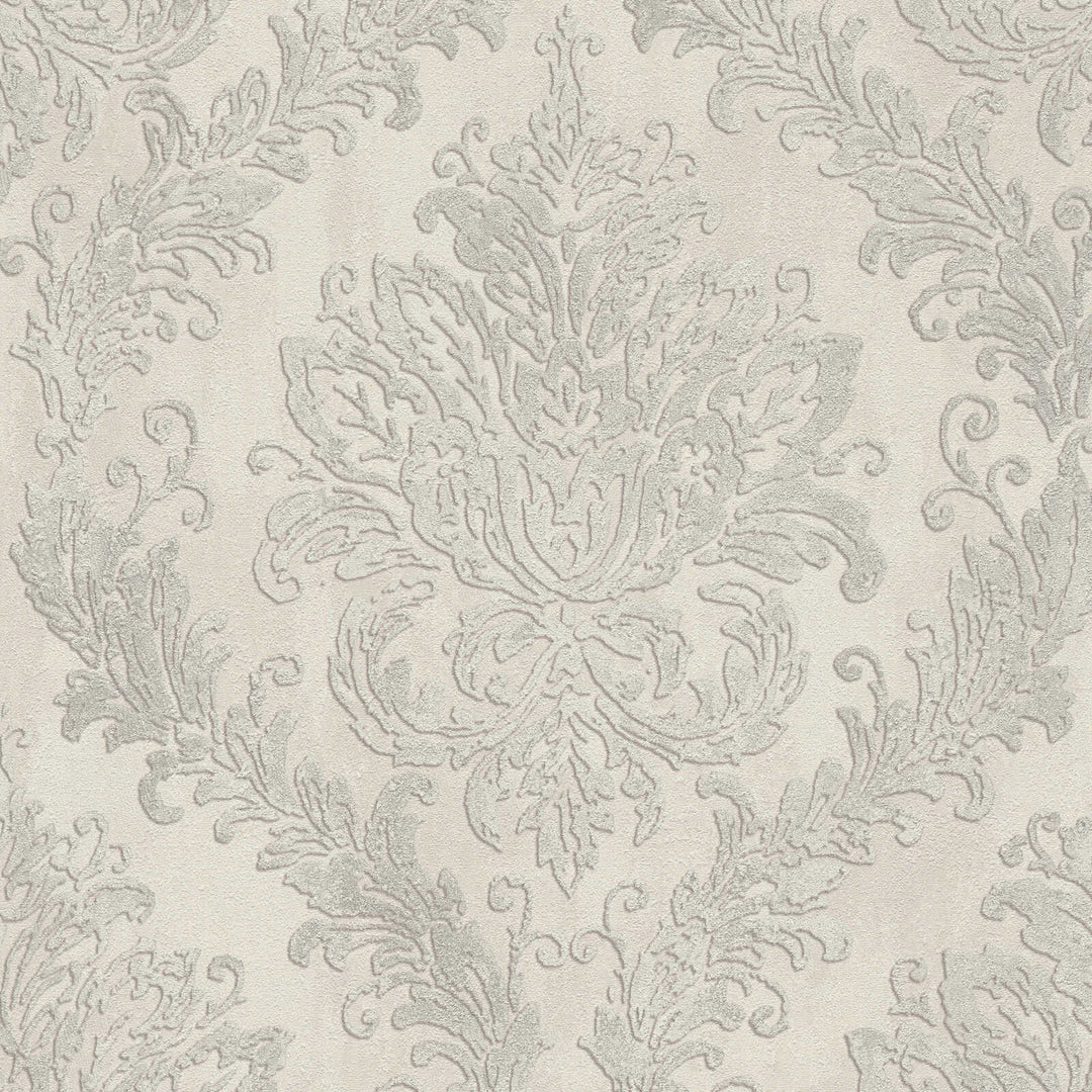 Light gray wallpaper with a classic damask ornament, close-up