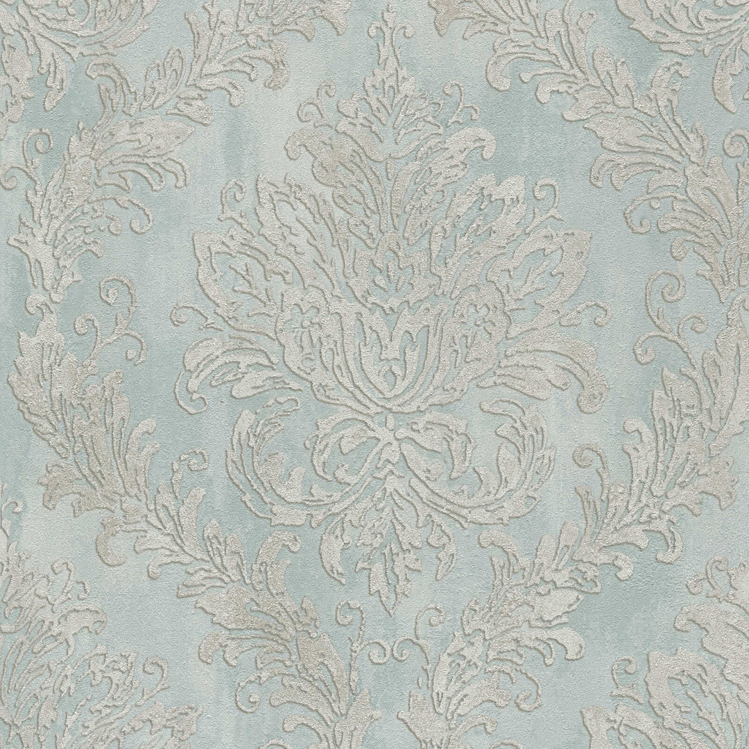 Light blue wallpaper with a classic damask ornament, close-up