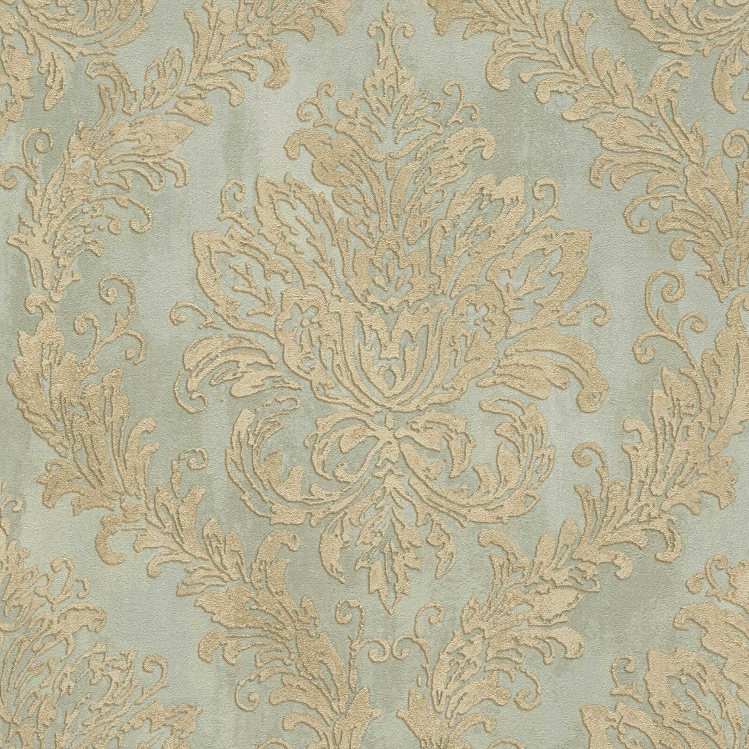 Light greenish wallpaper with a golden damask ornament, close-up