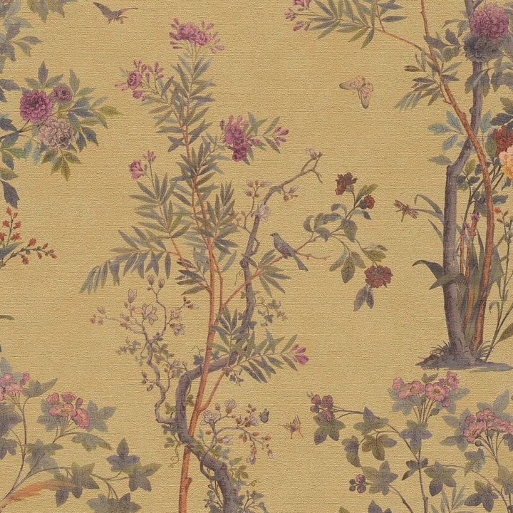 Golden-yellow wallpaper with a drawing of blooming trees, birds, and butterflies, close-up