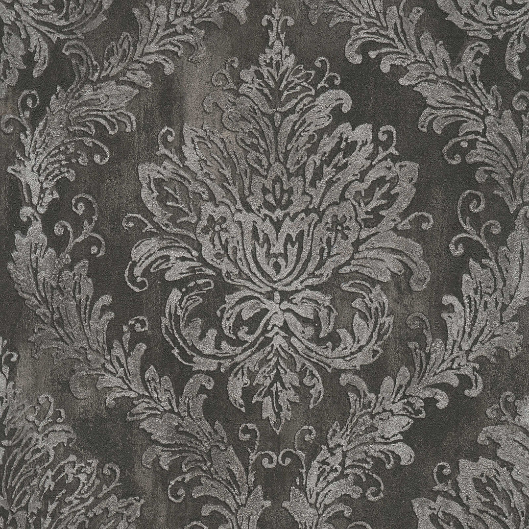 Dark gray wallpaper with a classic damask ornament, close-up