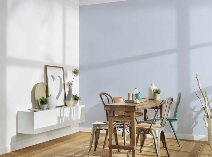 Light blue Plain wallpapers in a modern dining room interior with wooden furniture
