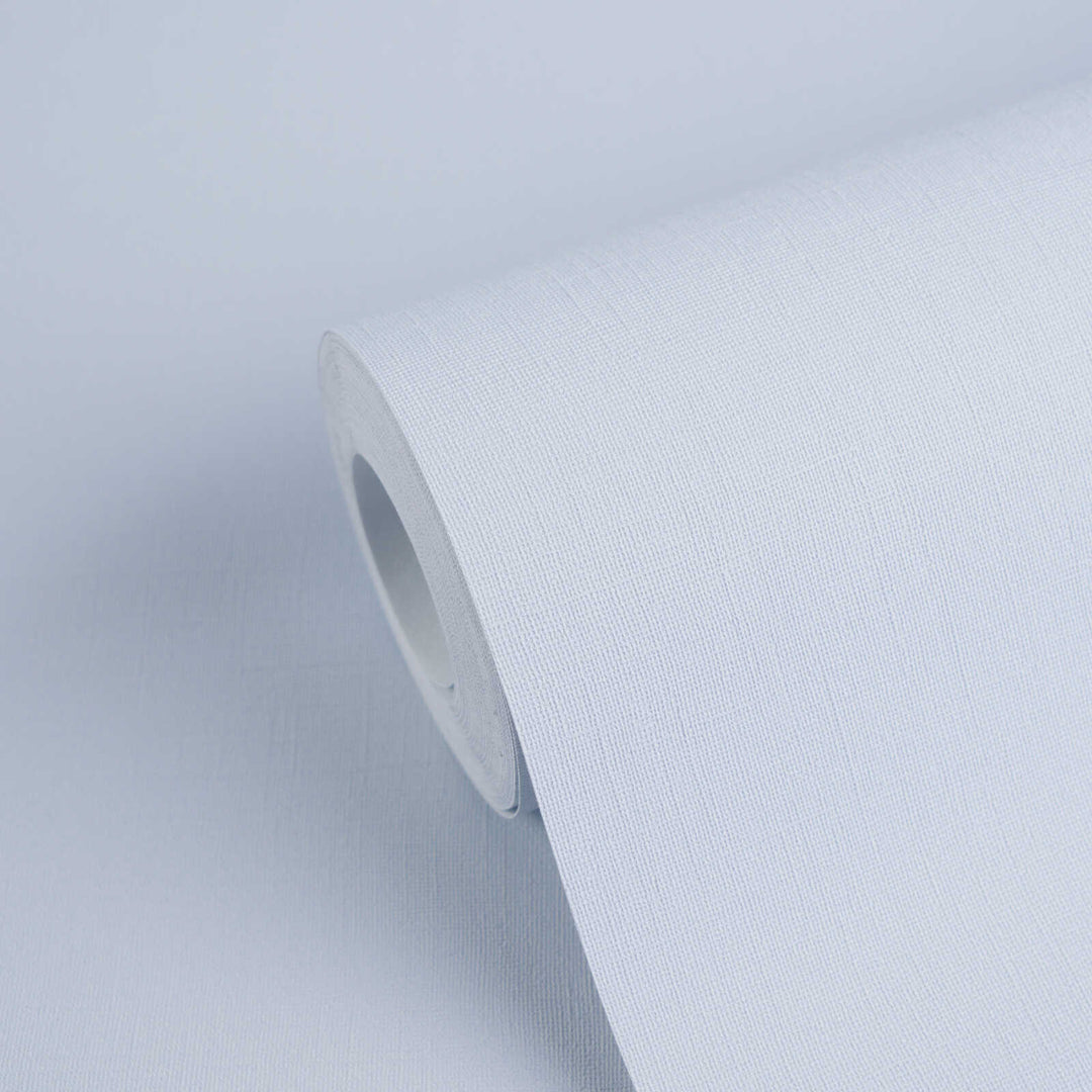 Light blue textured wallpaper roll with a close-up view of the fabric-like pattern