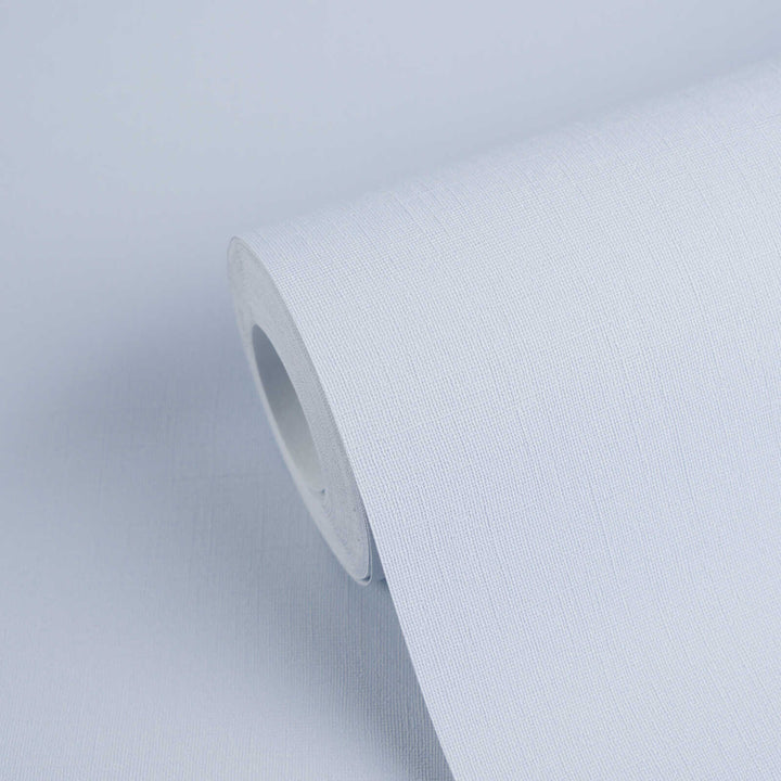Light blue textured wallpaper roll with a close-up view of the fabric-like pattern